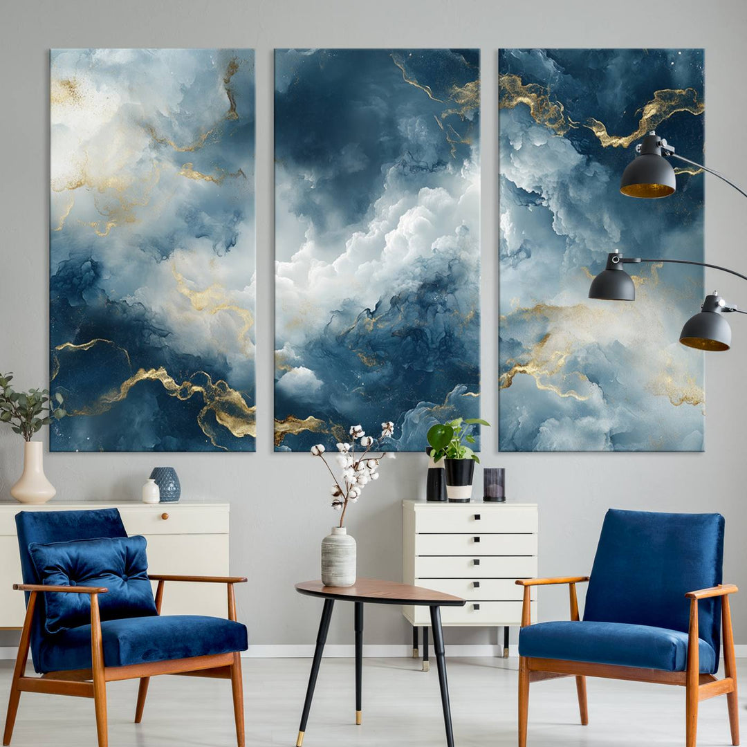 Modern living room featuring the Large Abstract Print - Luxe Blue and Gold Abstract Canvas Wall Art that showcases a bold cloudscape, perfect for modern home decor.