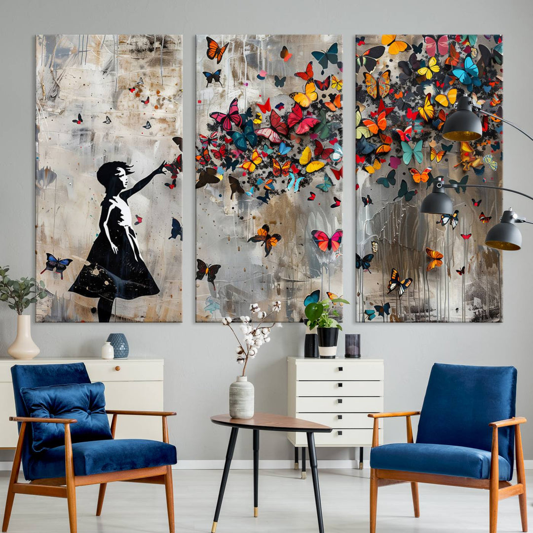 The Banksy Butterfly Girl 3-Piece Modern Graffiti Canvas Wall Art features a silhouette of a girl reaching for butterflies.