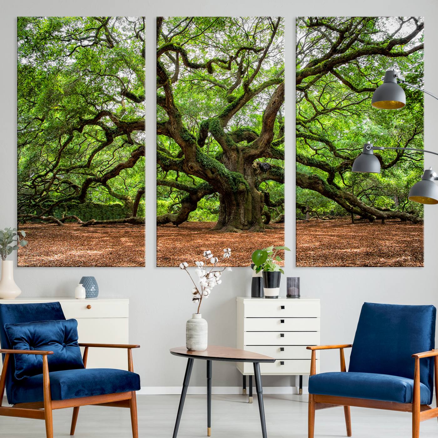 A majestic, ancient tree with expansive, twisting branches spreading wide under a dense, vibrant green canopy in a serene forest clearing.