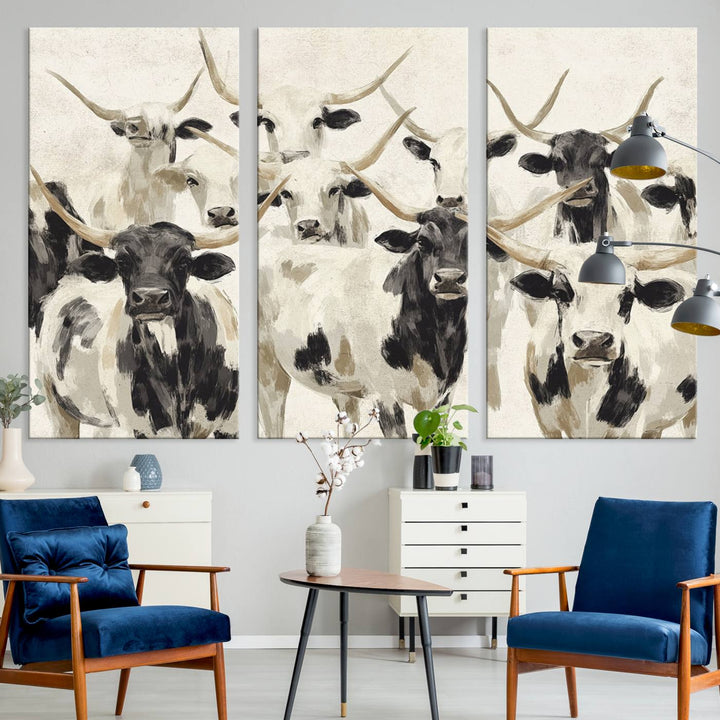 Canvas print titled Longhorn Texas Cow Drawing, depicting longhorn cattle with black and white markings, made in the USA, displayed on the wall.