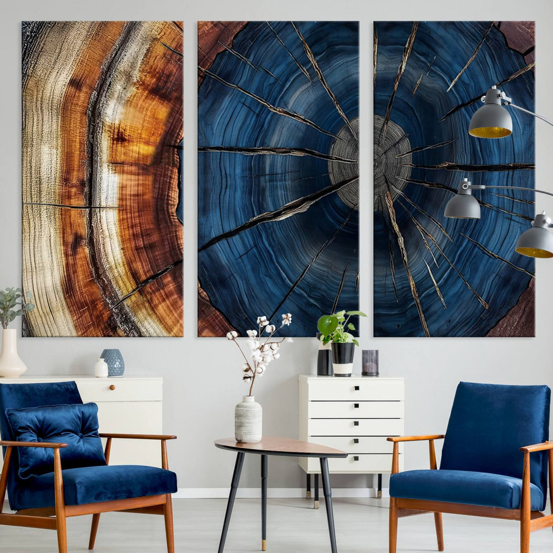 The Abstract Tree Rings Canvas Print features blue, brown, and orange rings that highlight wood grain and natures beauty.