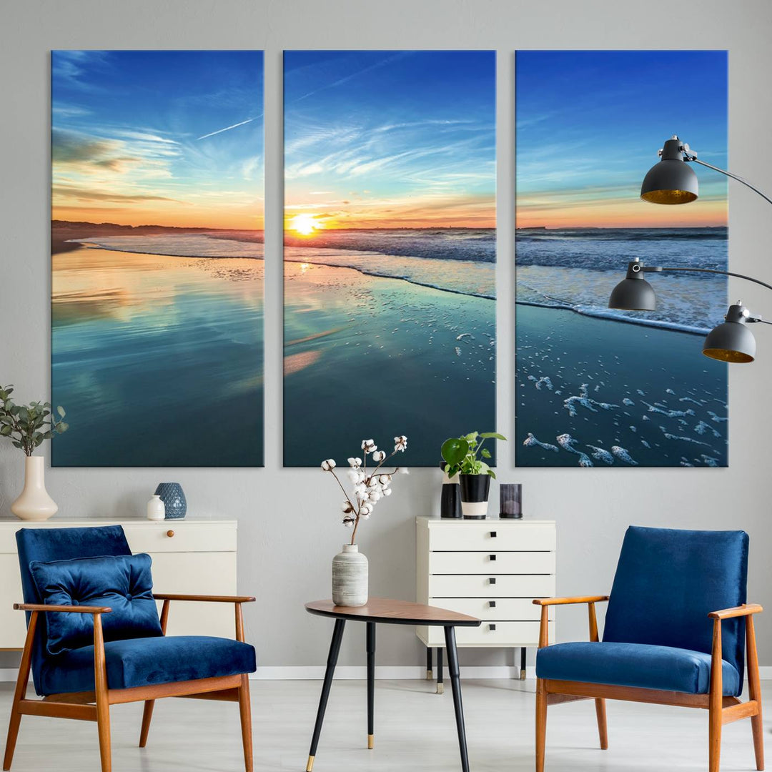 The Blue Sky and Beach Wall Art Canvas Print features a vibrant orange sky reflecting on wet sand.