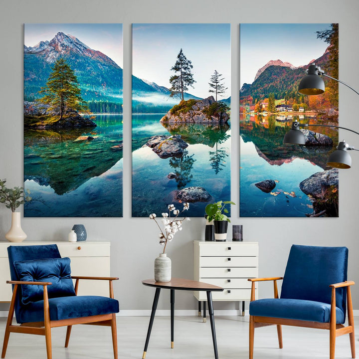 The 3-panel wall art showcases a serene mountain lake with rocky islands and trees, creating an ideal focal point for dining rooms or offices.