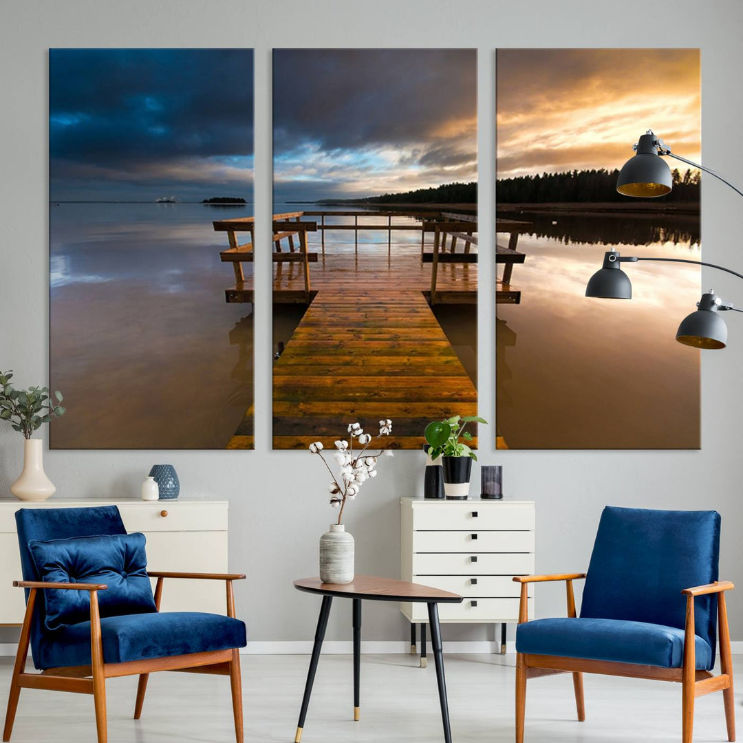 The "Serene Lake Pier at Sunset" landscape canvas print, crafted as ready-to-hang and framed wall art, enriches the contemporary setting by capturing the tranquility of a lakeside pier at sunset.