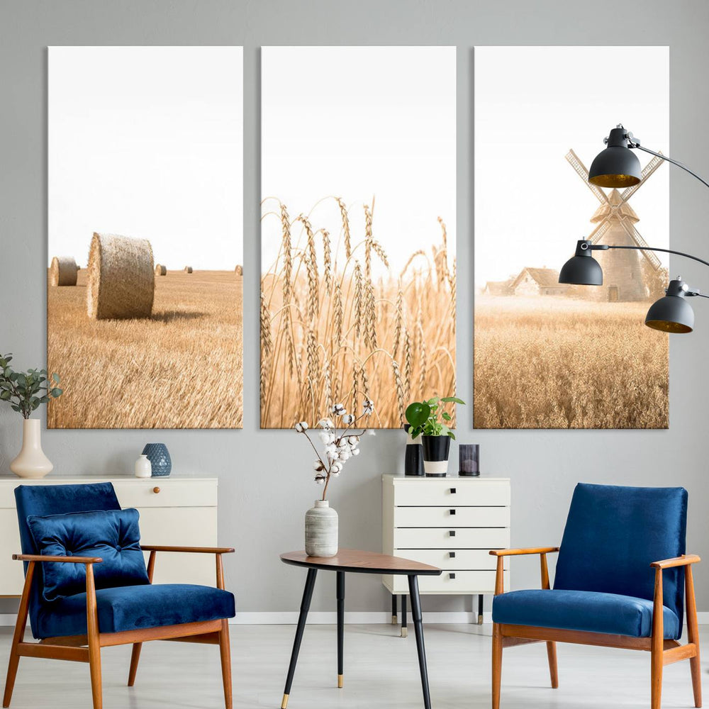 A Vintage Farmhouse Triptych depicting wheat fields, hay bales, and a windmill is displayed prominently on the wall.