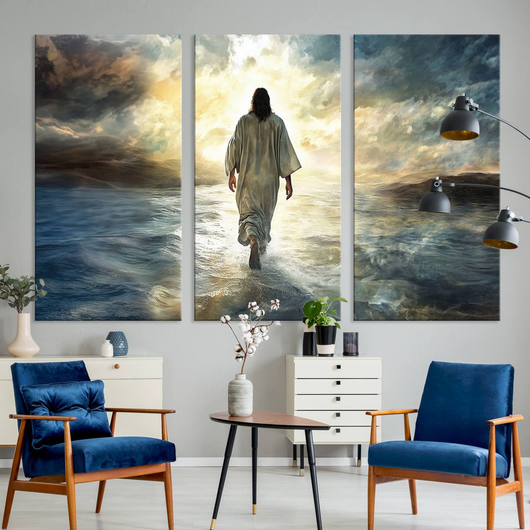 The Jesus Walking on Water Wall Art, a captivating triptych canvas print, showcases a person walking on water beneath dramatic clouds. This ready-to-hang piece seamlessly combines faith and style for your Christian home decor.