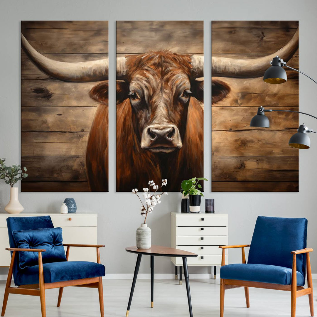 The Longhorn Bull Wall Art, a ready-to-hang canvas print, showcases an image of a brown longhorn cow set against a wooden background, perfect for those looking to enhance their space with rustic farmhouse and western barn decor.