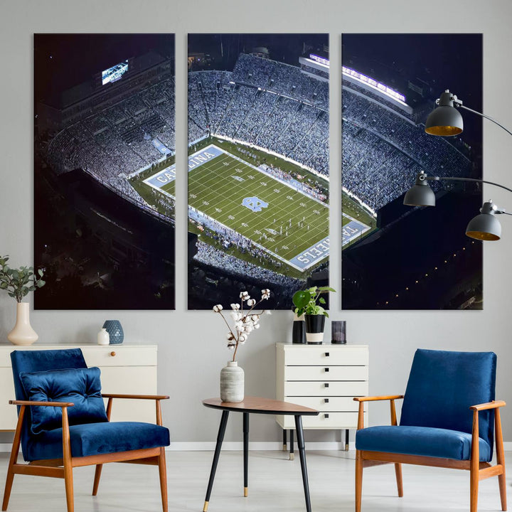 A University of North Carolina Tar Heels Football Team Print, showcasing Chapel Hill's Kenan Memorial Stadium, hangs in a modern dining room, adding a gallery-quality finish that enhances the entire space.