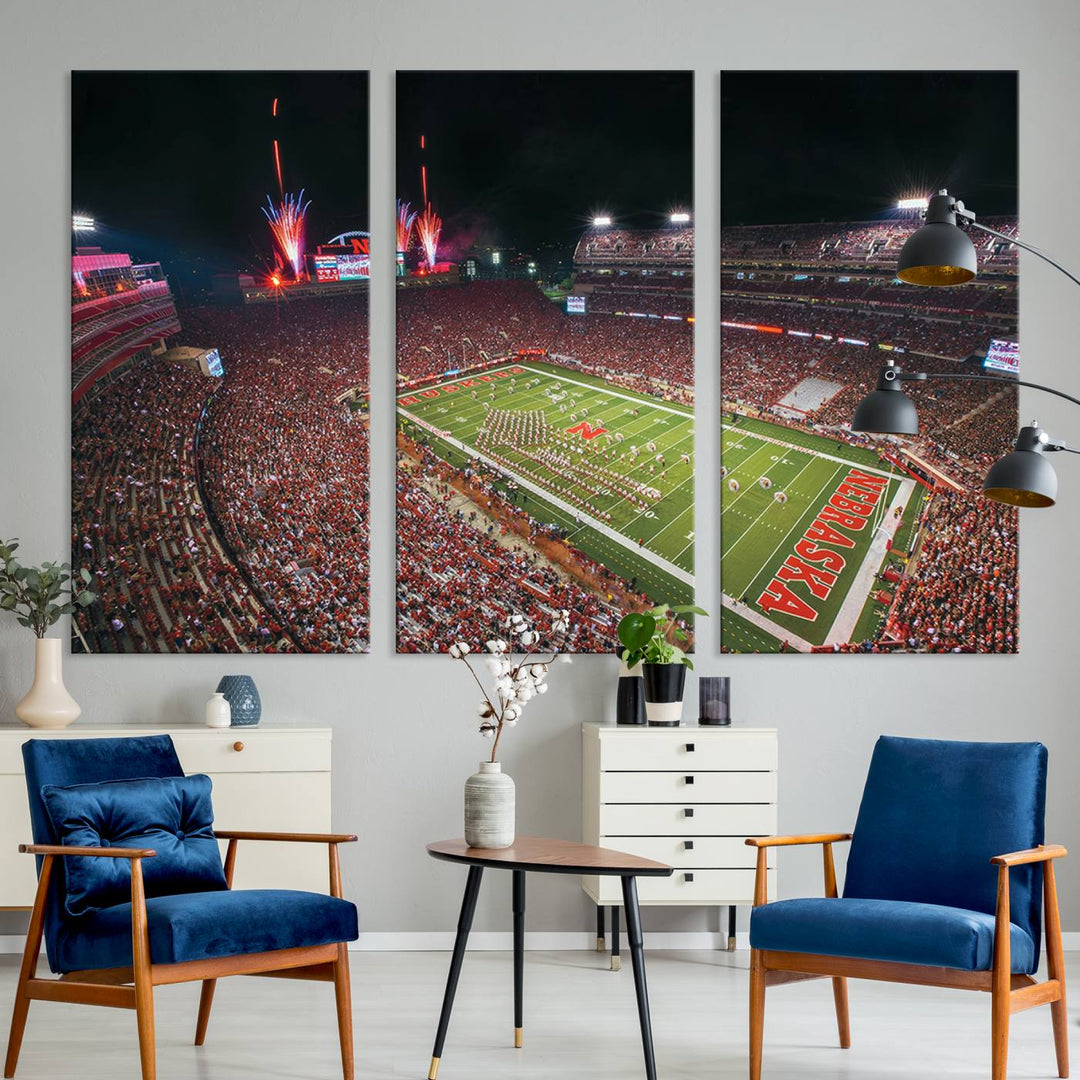 The University of Nebraska Cornhuskers Football Team Print, featuring Lincoln Memorial Stadium in a vibrant triptych canvas with fireworks above and a gallery-quality finish, is elegantly displayed.