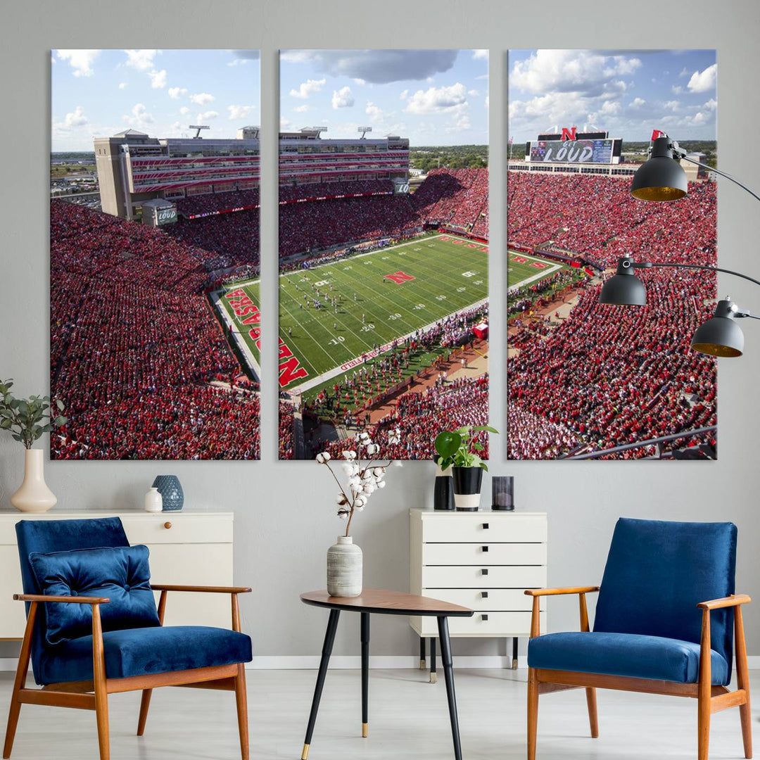 The University of Nebraska Cornhuskers Football Team Print showcases a vibrant triptych of Lincoln Memorial Stadium, depicting a packed football stadium filled with energetic fans. This handmade art piece is crafted in the USA and printed on premium canvas for a gallery-quality finish.