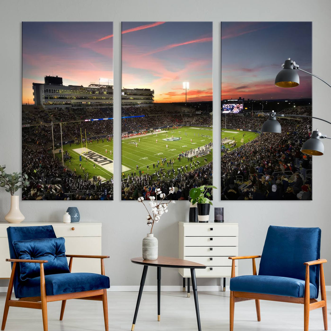 This wall art canvas print captures UCONN Huskies fans energizing a sunset scene at East Hartfords Pratt & Whitney Stadium.