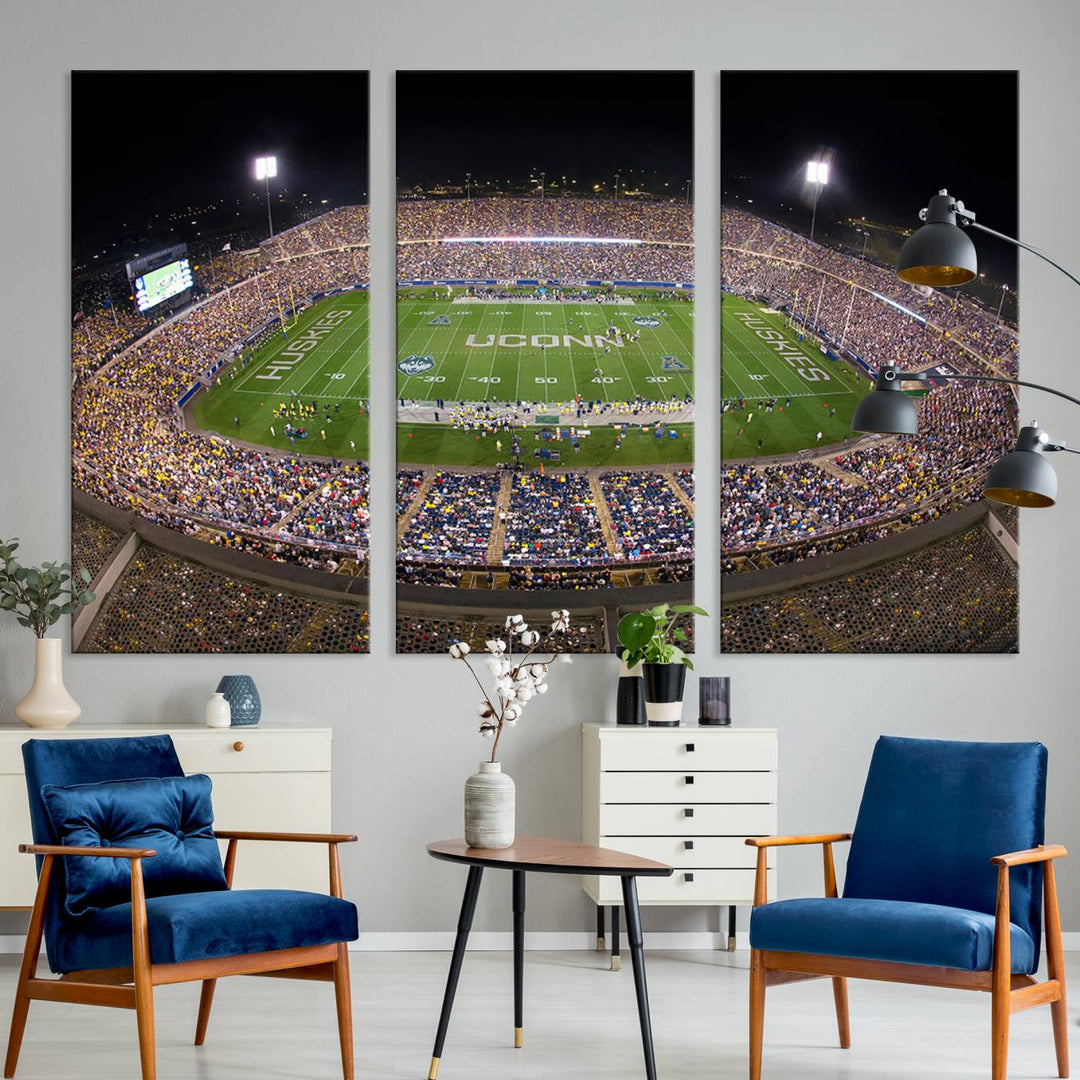 A large football stadium at night, featuring the UCONN Huskies, is depicted on the East Hartford Pratt & Whitney Stadium Wall Art Canvas Print.