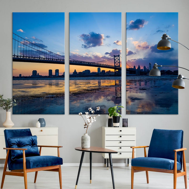 A photograph titled "Large Wall Art Philadelphia Canvas Print - Benjamin Franklin Bridge at Sunset" displays a breathtaking cityscape of the bridge reflected in the water. This image features a gallery-quality finish that promises to transform any space into an evocative memory.