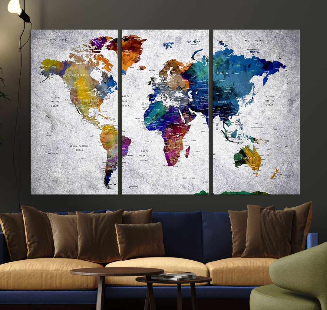 The World Map Art Canvas Print, featuring country names on a grunge-stained gray background, is perfect for stylish home decor.