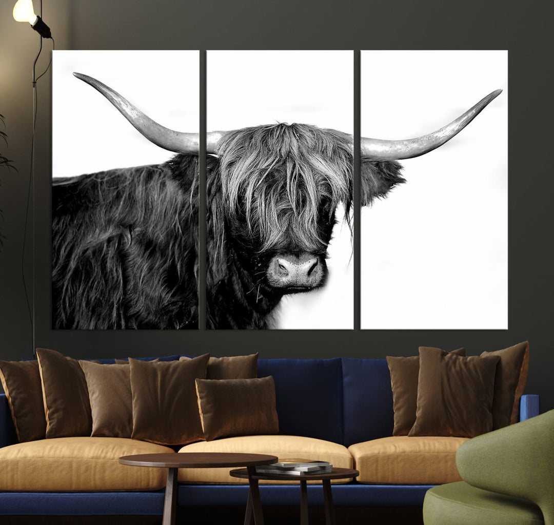 The Black and White Highland Cow Multi Panel Wall Art Canvas Print with UV-protection hangs prominently.