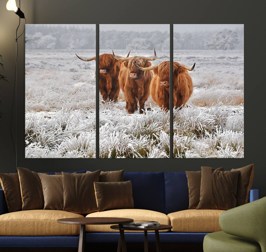 The Highland Cows in Snow canvas showcases three cattle in a frosty field.