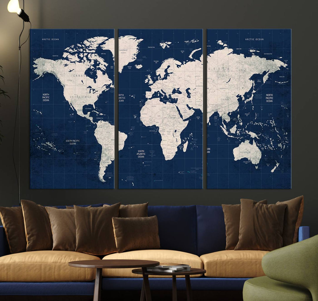 Large modern world map wall art canvas print in beige and navy; showcases a 3-panel vintage map design and is ready to hang.