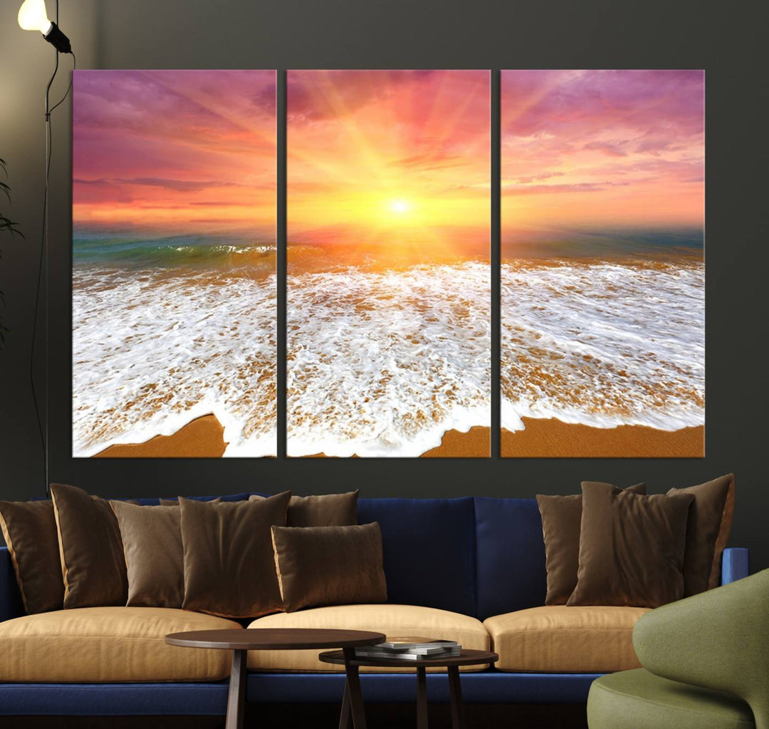 The "Golden Beach Sunrise Canvas Wall Art," a three-panel giclee print featuring ocean waves on a sandy shore, beautifully adorns the gray wall.