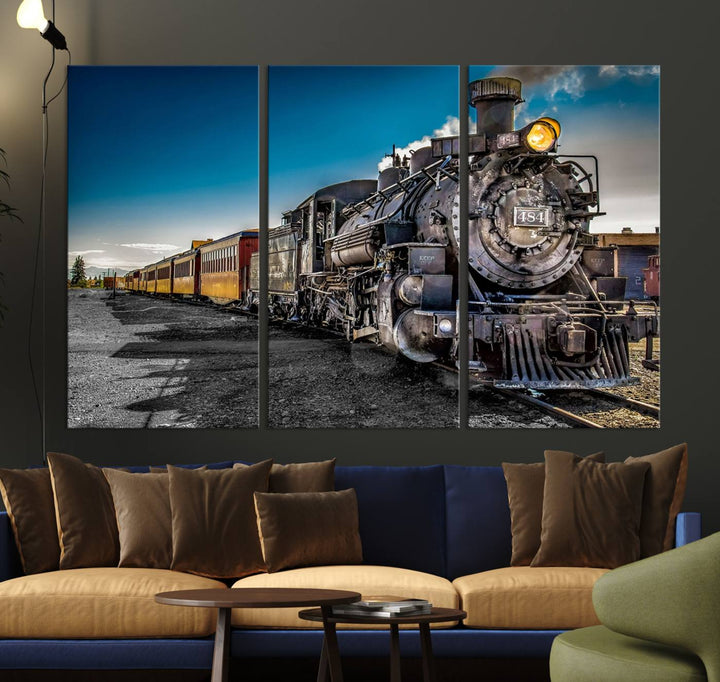 The Train Wall Art Canvas Print features a vintage steam train with a bright headlight.