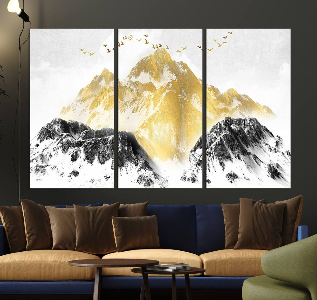 Golden Mountain Triptych Wall Art features gold-tinted mountains and birds.