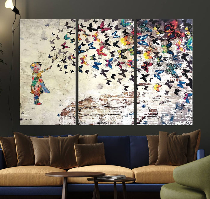 A Banksy Girl Butterfly Canvas Print is displayed on the textured wall.