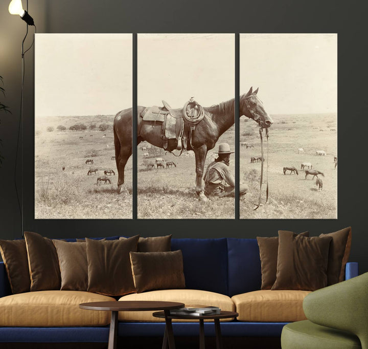 Cowboy Wall Art - Vintage Western Horse Canvas Print features a cowboy kneeling by his horse in a field.