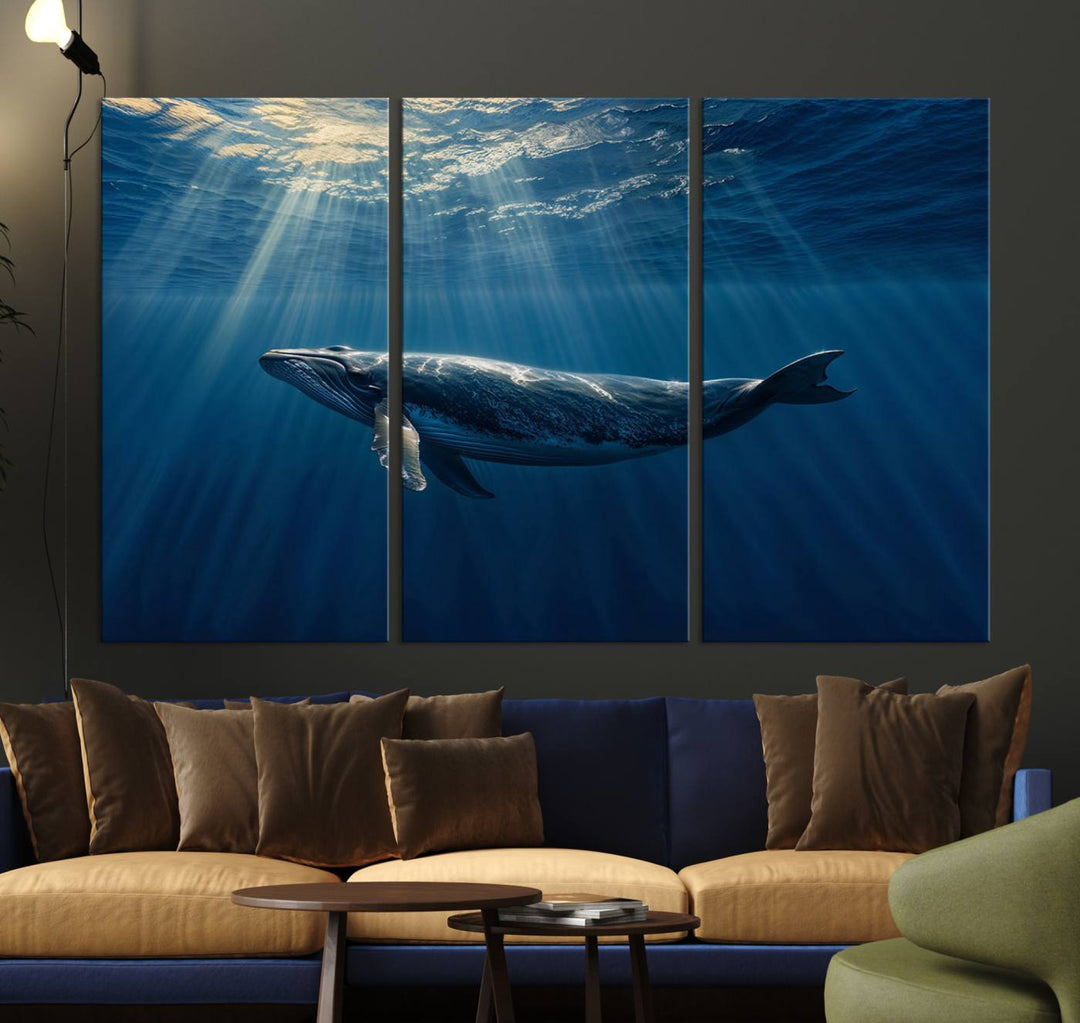 The Whale under Ocean wall art canvas print graces the white wall.