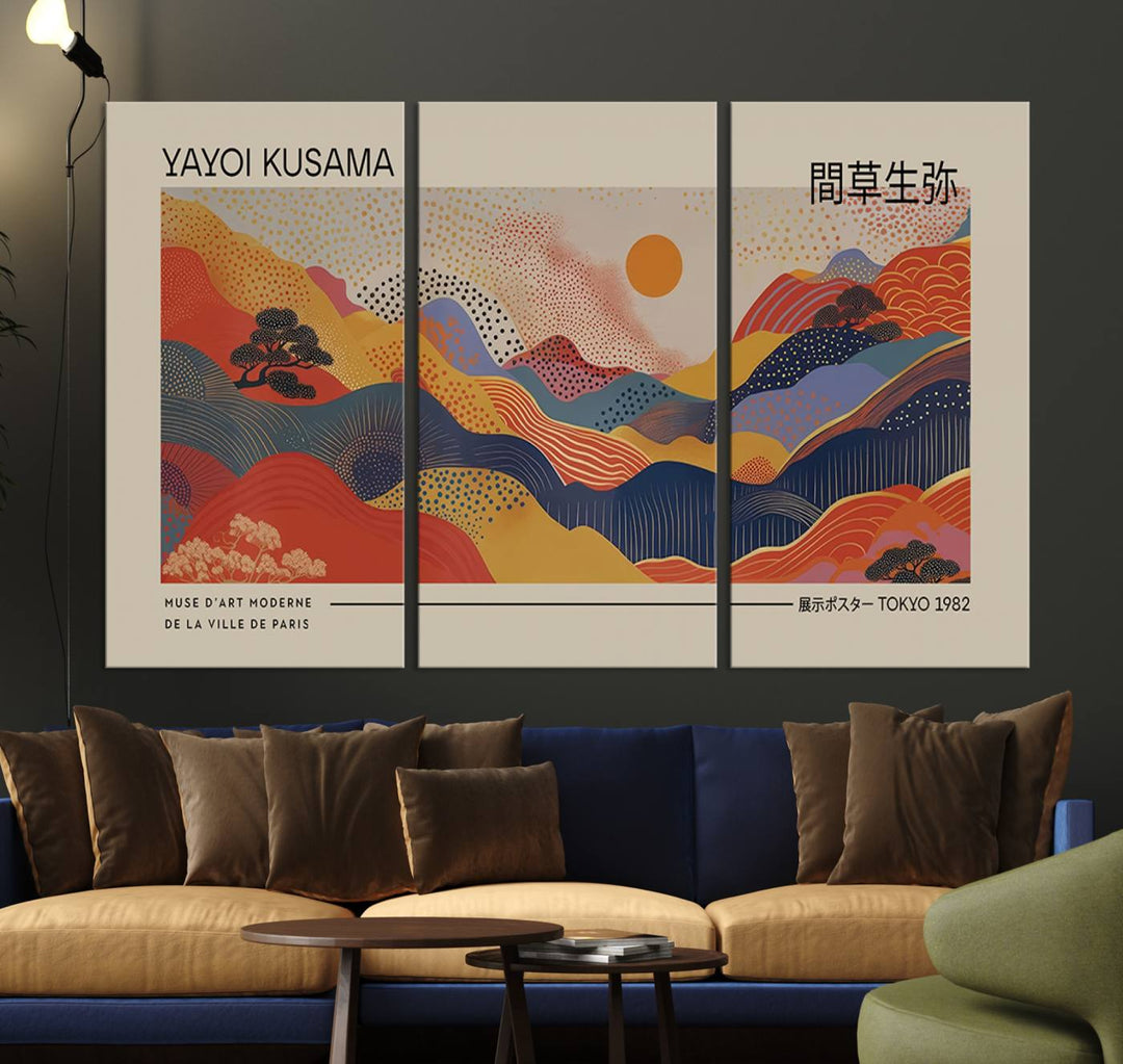 The Yayoi Kusama vibrant landscape canvas print featuring abstract mountains and a sun enhances the space with its modern aesthetic.