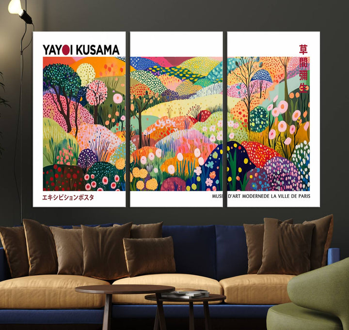 Three vibrant, abstract Yayoi Kusama wall art prints adorn a black wall, creating a perfect blend of contemporary décor.