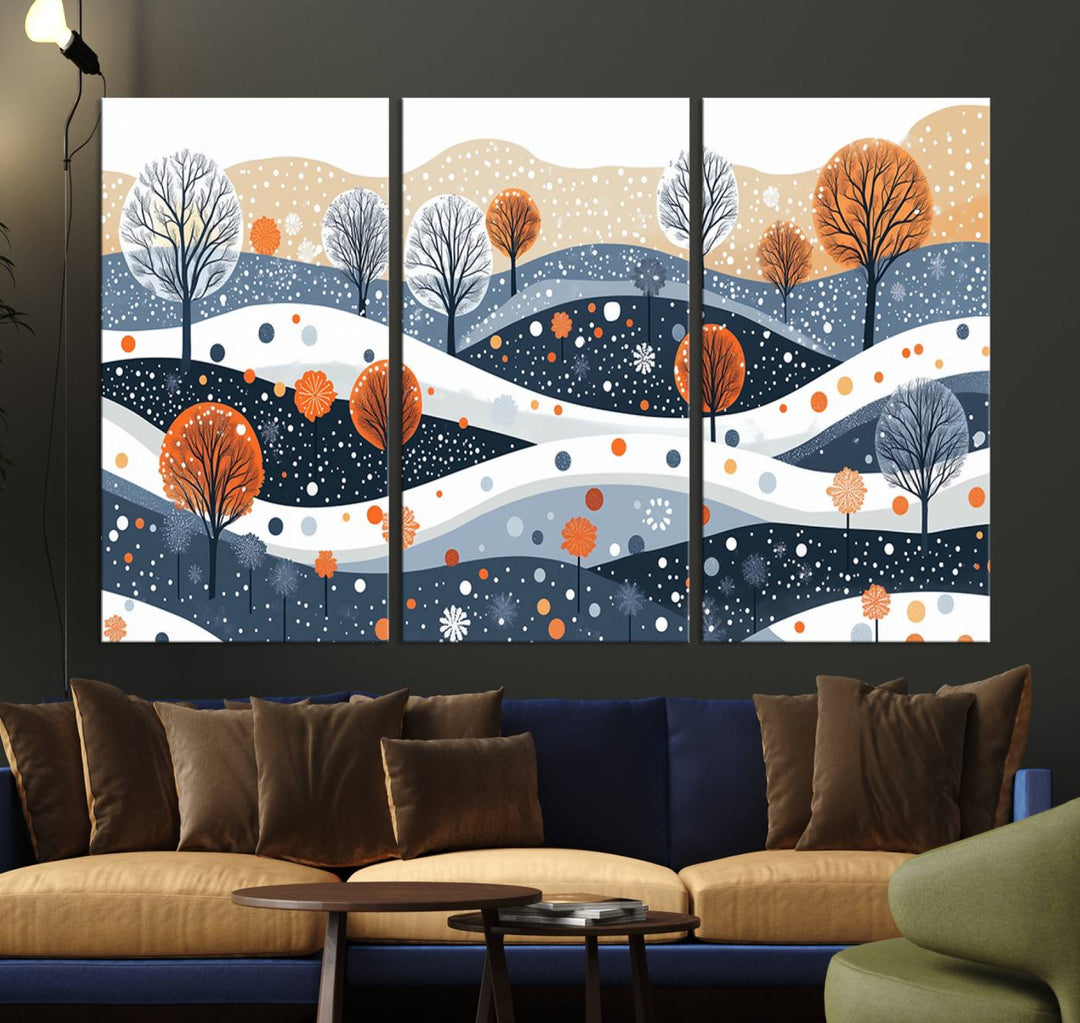 The "Abstract Winter Landscape Canvas Wall Art Print," featuring a triptych of landscapes with trees and hills in vibrant orange, white, and blue hues, adds a gallery-quality finish that transforms the space into an art lover's dream.