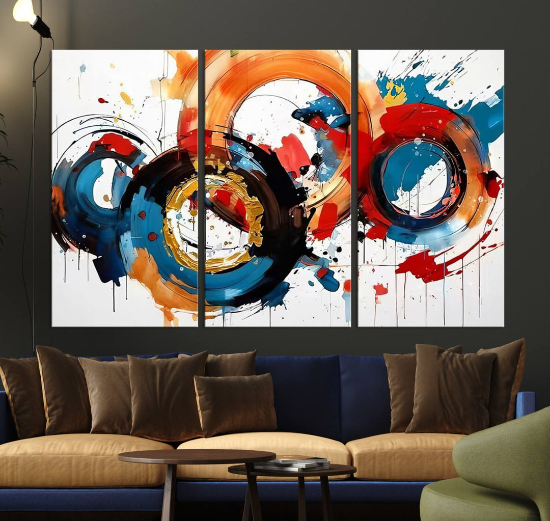 The Abstract Wall Art Rings Canvas Print, with its bold and colorful circular strokes, adorns the wall, epitomizing contemporary design.