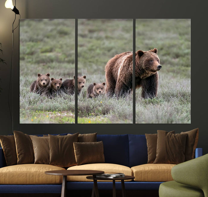 The large canvas print titled "Queen of the Tetons, 399 Grizzly Bear Cubs" showcases majestic wildlife photography of a bear and her cubs walking through the grass. This stunning canvas wall art, handmade in the USA, adds a charming touch to any room with its rustic decor appeal.