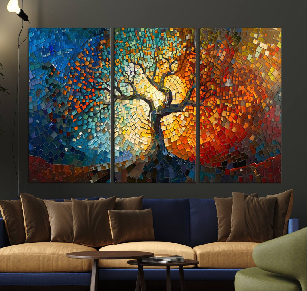 Mosaic Tree Canvas Wall Art: A stunning stained glass-inspired Tree of Life featuring blue and orange swirling patterns reminiscent of a sunburst.