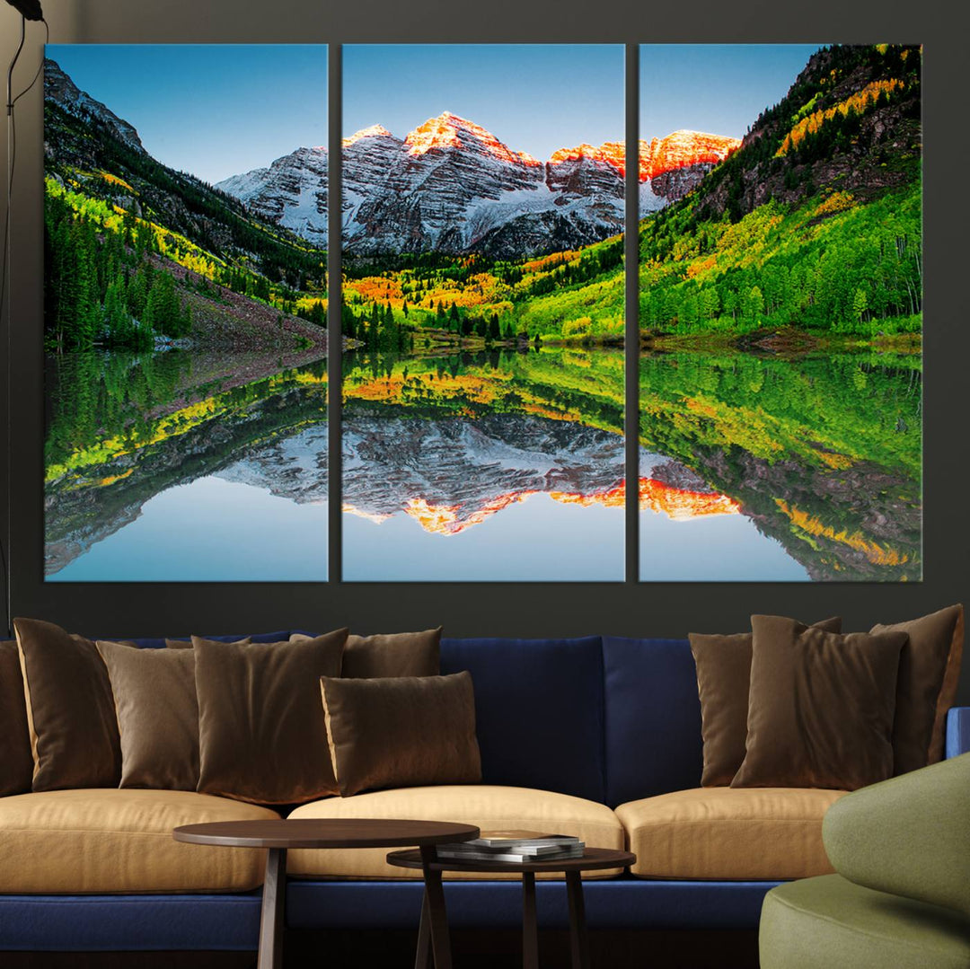 The Sunrise Maroon Bells Lake Wall Art Print beautifully captures North Maroon Peak mirrored in the tranquil lake, framed by lush greenery.