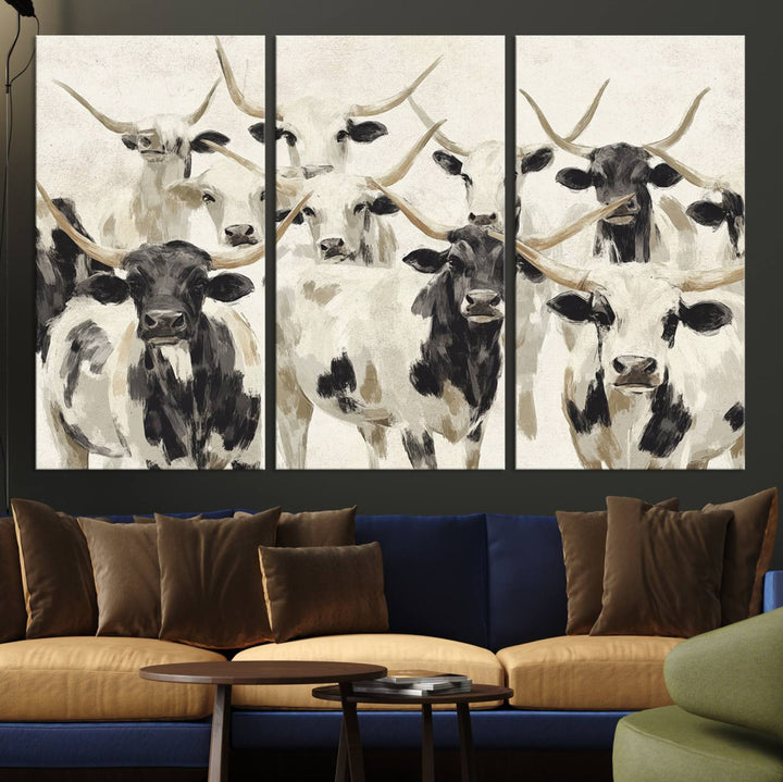 Canvas print titled Longhorn Texas Cow Drawing, depicting longhorn cattle with black and white markings, made in the USA, displayed on the wall.