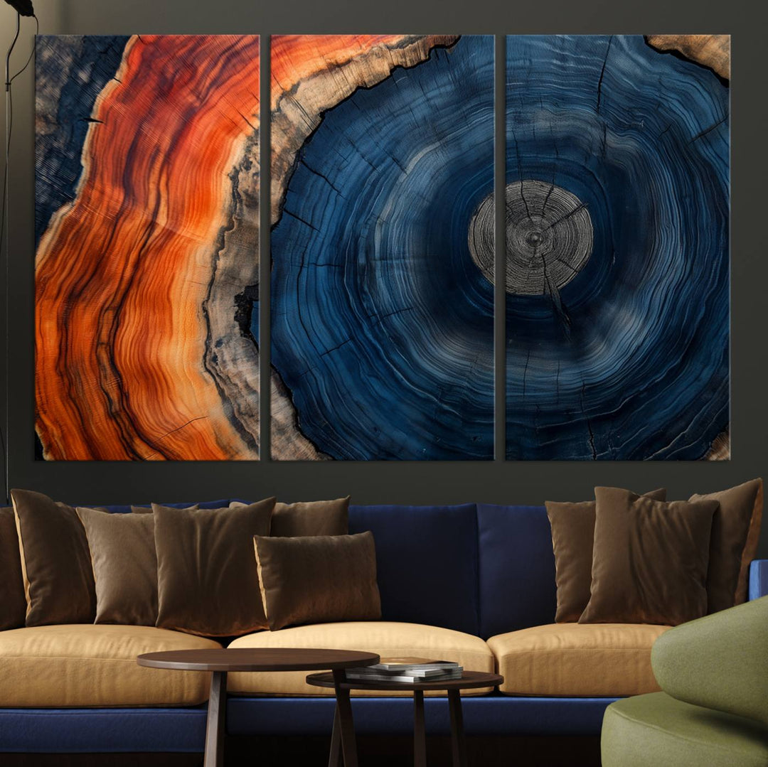 Abstract Tree Ring Wall Art Print on canvas featuring vibrant blue, orange, and brown rings with a natural rustic wood texture. Free shipping available!.