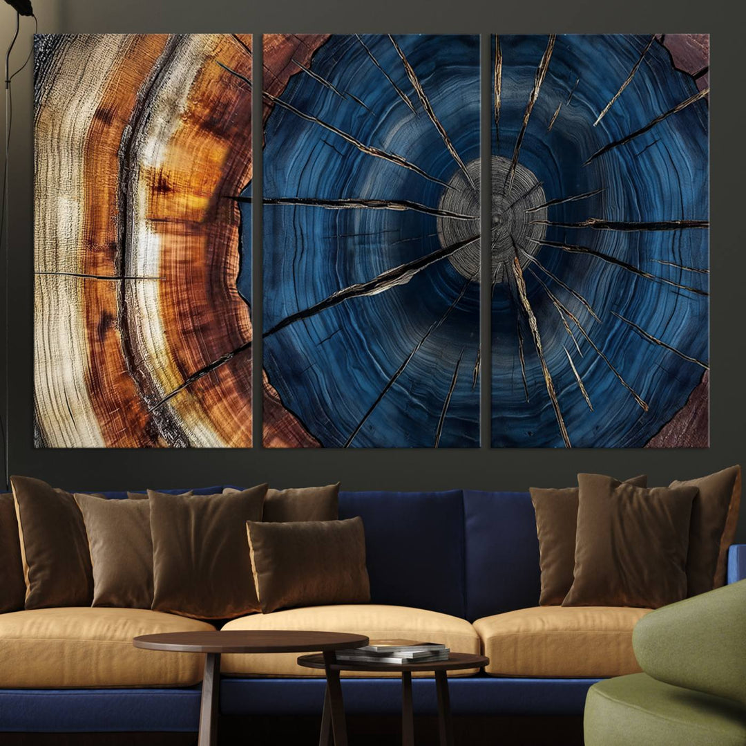 The Abstract Tree Rings Canvas Print features blue, brown, and orange rings that highlight wood grain and natures beauty.