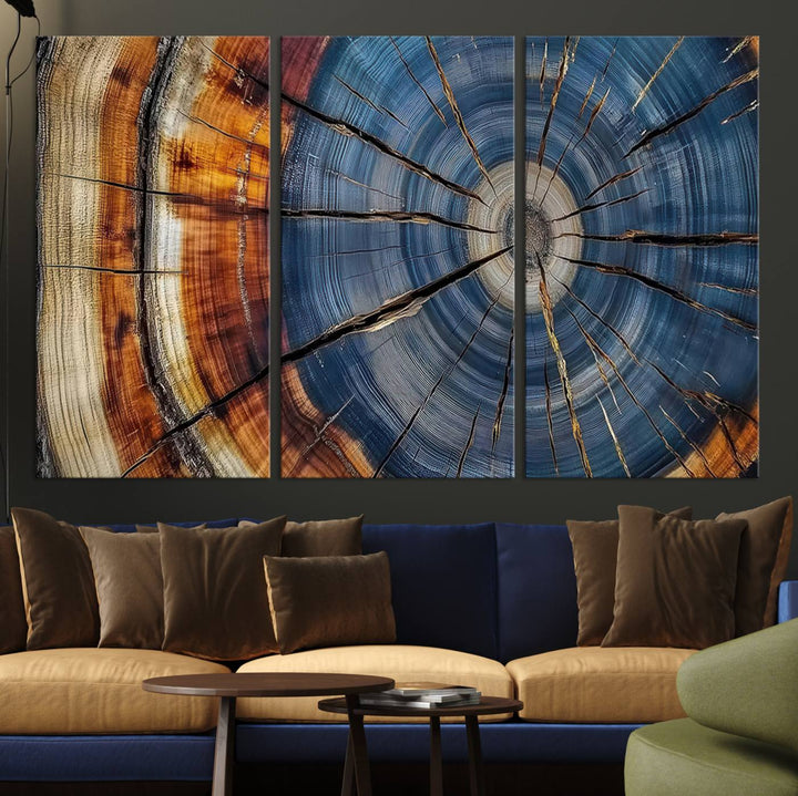 Close-up of blue, brown, and orange wood grain rings on the Abstract Tree Rings Canvas Wall Art Print.