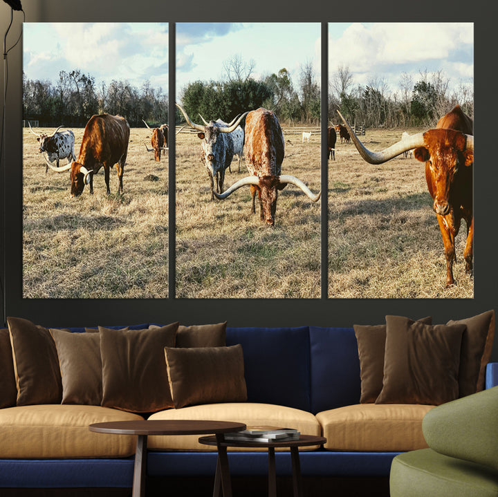 A herd of Texas Longhorn cattle grazing in an open field under a partly cloudy sky, capturing a rustic and Western ranch aesthetic.