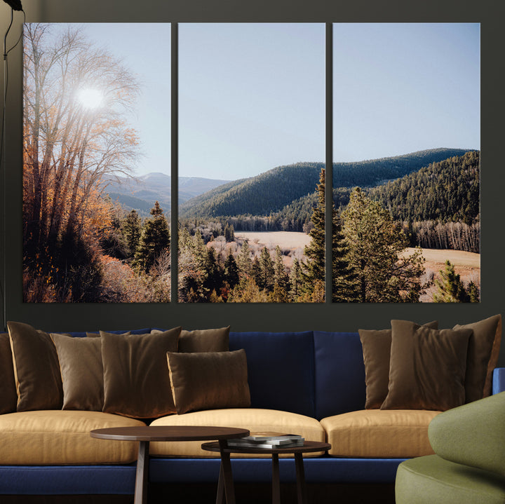 A scenic mountain valley with pine trees and autumn foliage under a clear sky, bathed in golden sunlight, creating a peaceful and rustic landscape.