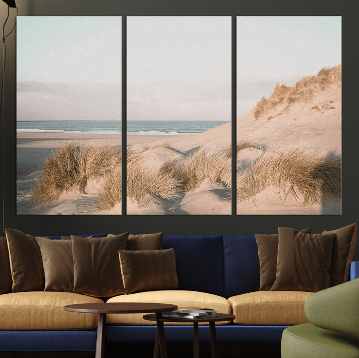 Soft pastel-toned beach scene with sand dunes, windswept grasses, and a calm ocean horizon, creating a serene coastal atmosphere.