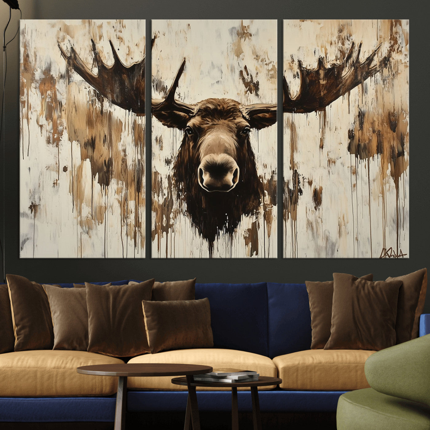 Expressive painting of a moose head with wide antlers in dark brown and beige tones, featuring paint drips and splatters on a light textured background, creating a striking rustic wall art canvas.