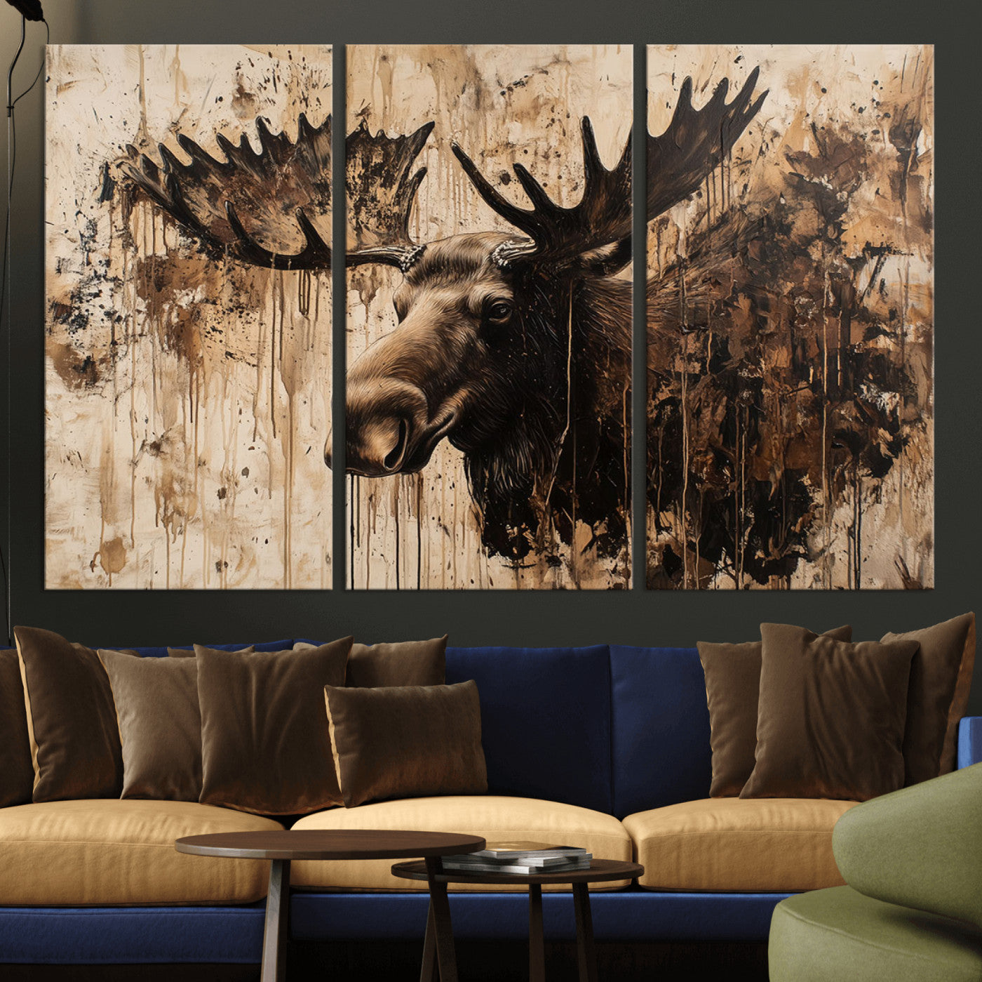 Artistic painting of a moose head with large antlers in shades of brown and black, with paint splatters and drips on a beige textured background, creating a rustic and expressive wall art canvas.