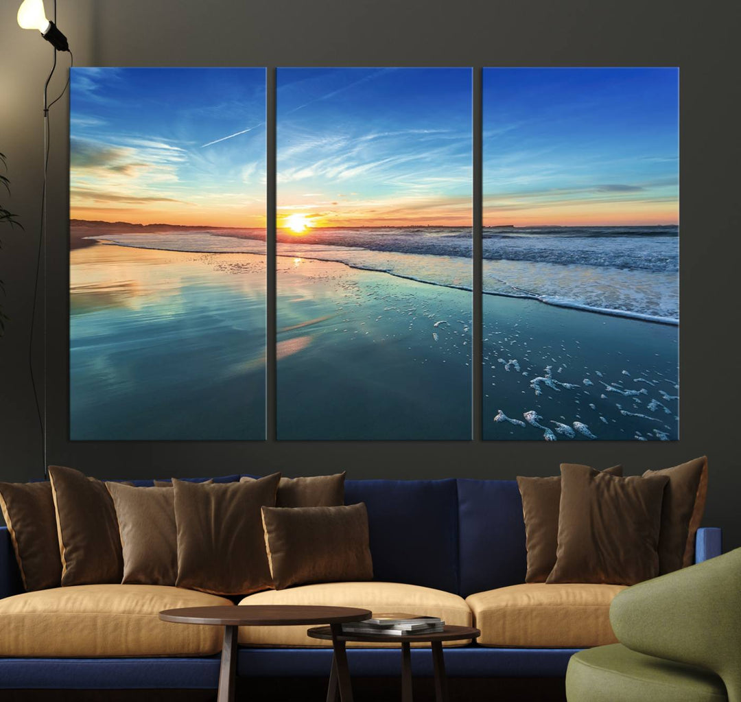 The Blue Sky and Beach Wall Art Canvas Print features a vibrant orange sky reflecting on wet sand.