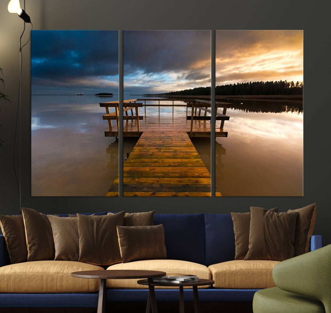 The "Serene Lake Pier at Sunset" landscape canvas print, crafted as ready-to-hang and framed wall art, enriches the contemporary setting by capturing the tranquility of a lakeside pier at sunset.