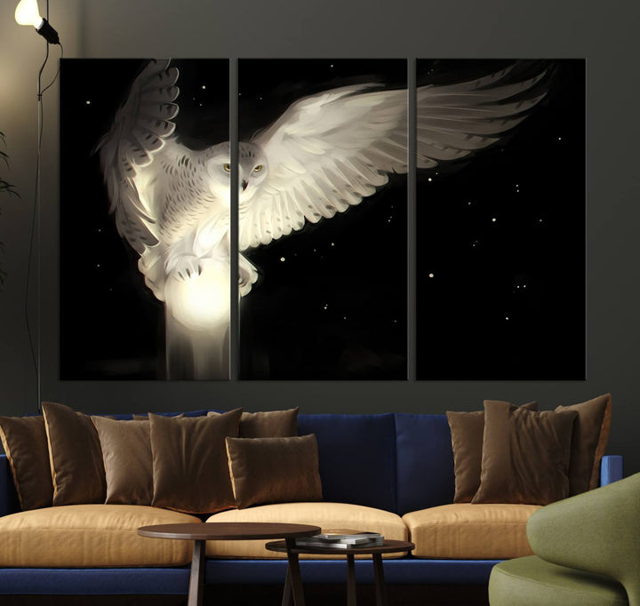 The Night Owl Art graces the wall with its depiction of a snowy owl on a glowing orb, perfect for modern decor.