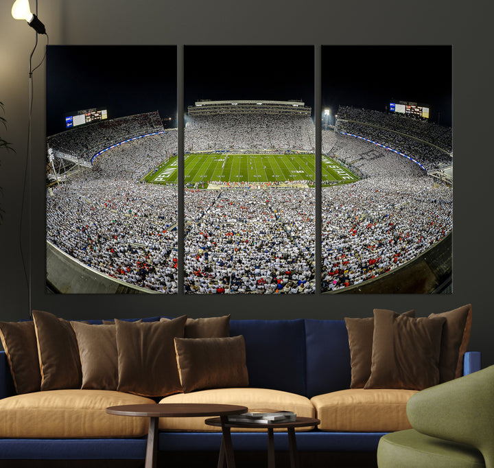 The Beaver Stadium Night Game Triple Canvas Wall Art - Penn State Nittany Lions Football Match features a panoramic view of a packed Beaver Stadium at night.