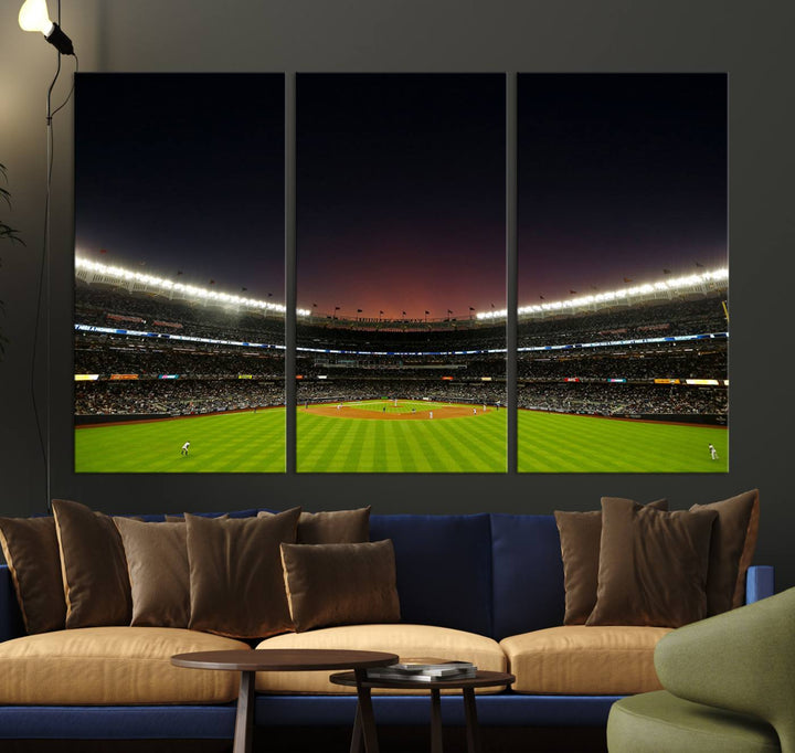 A night game at Yankee Stadium depicted on canvas beneath a sunset sky.