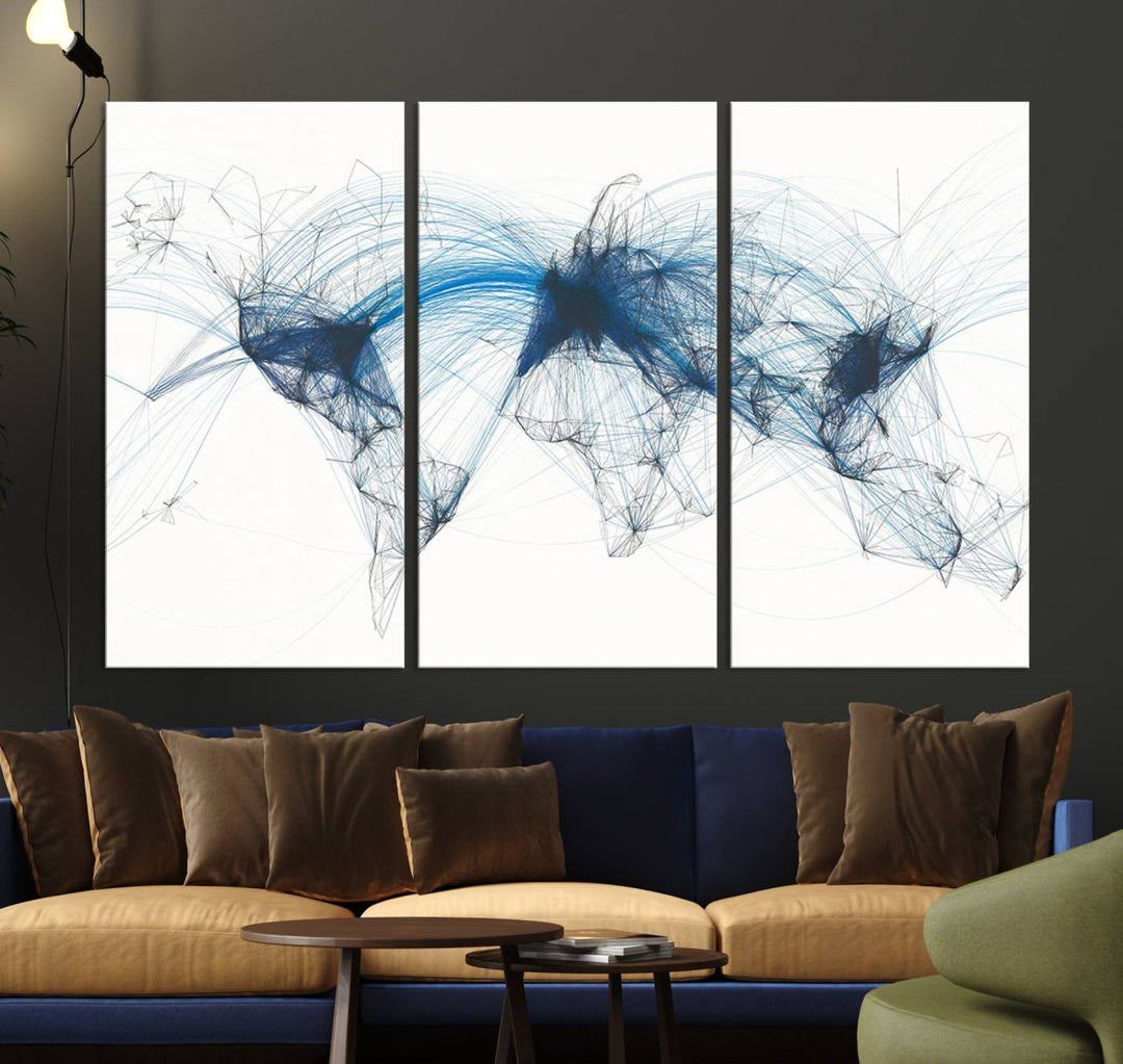 The Aviation Flight Map Wall Art is a set of three abstract panels featuring a world map with blue lines, resembling a flight map. Ideal for aviation enthusiasts, this ready-to-hang framed air traffic art print enhances the appeal of modern decor.