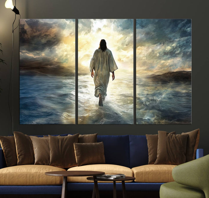 The Jesus Walking on Water Wall Art, a captivating triptych canvas print, showcases a person walking on water beneath dramatic clouds. This ready-to-hang piece seamlessly combines faith and style for your Christian home decor.